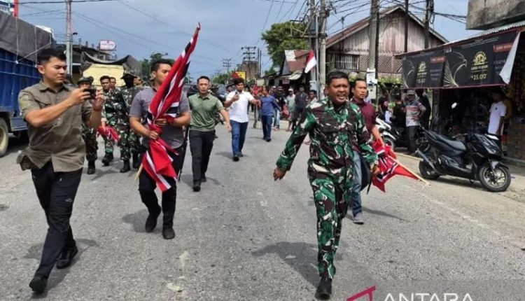 Aksi massa pembawa bendera GAM